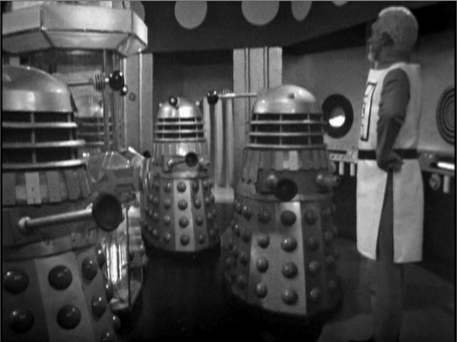 A still from the "Doctor Who" story "The Daleks' Master Plan." In their base, three Daleks square off against Mavic Chen, the Guardian of the Solar System.